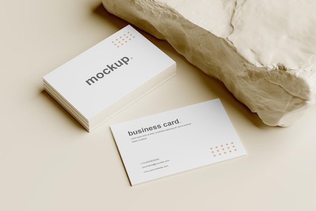 Business Card Mockup and Stack Perspective View With White Rock