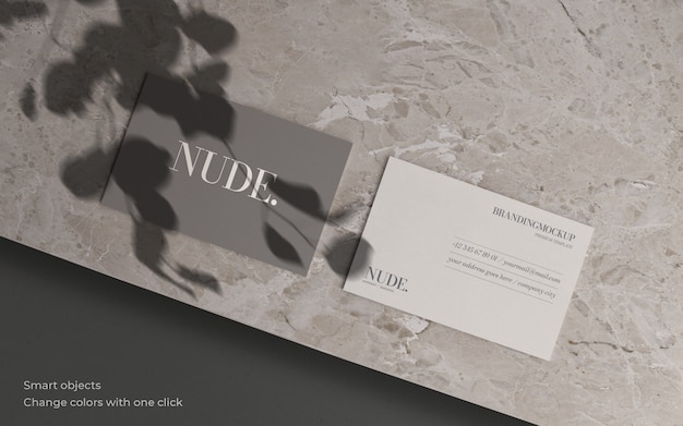 Business card mockup with botanical shadow and marble texture