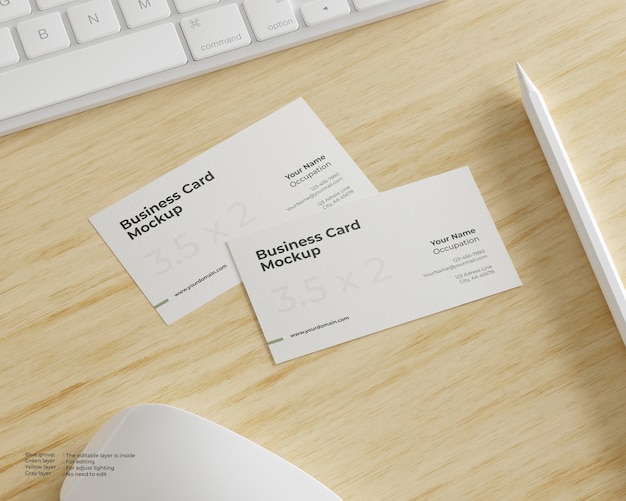 Business card mockup with keyboard, mouse, and stylus