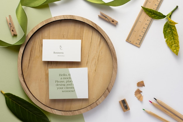 Business cards on wooden board top view