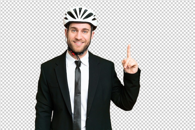 Business person with a bike helmet over isolated chroma key background pointing up a great idea