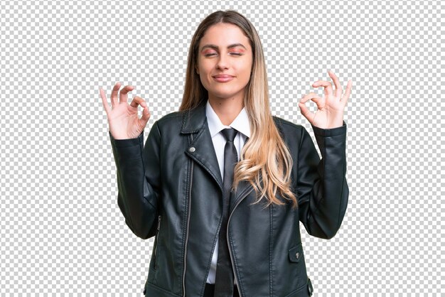 PSD business pretty uruguayan woman wearing a biker jacket over isolated background in zen pose