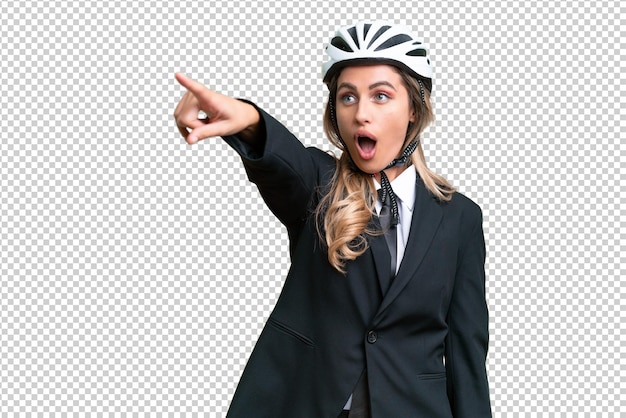 Business Uruguayan woman wearing a helmet biker over isolated background pointing away