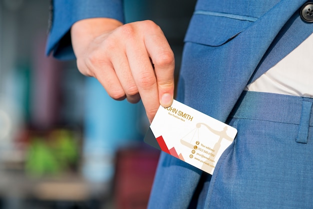 Businessman pulling out business card mockup