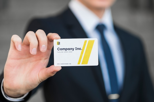 Businessman with business card mockup