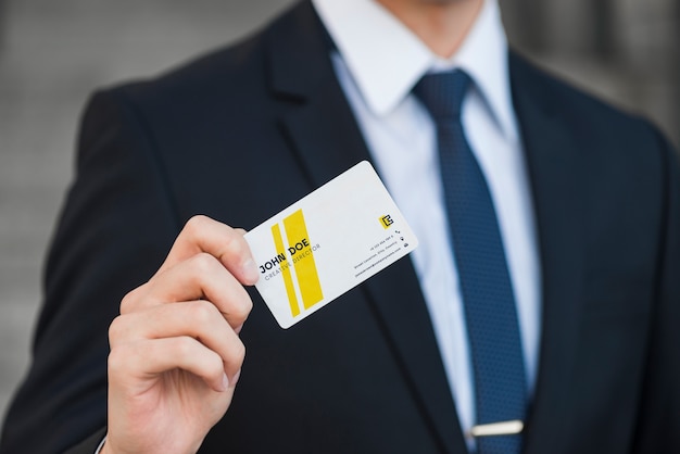 Businessman with business card mockup