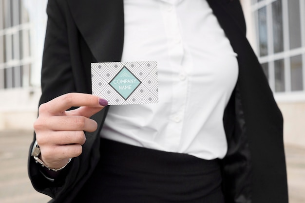 Businesswoman showing business card