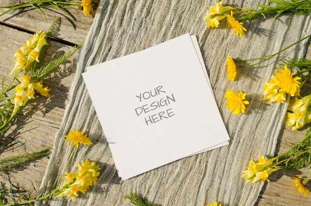 card mockup with yellow flowers on a old wood background in rustic style