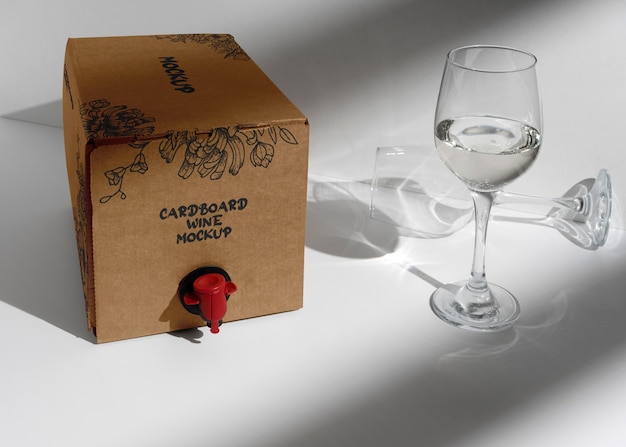 Cardboard wine dispenser with glass