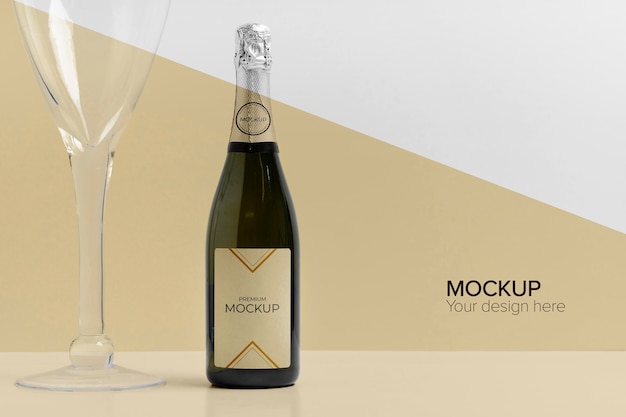 Champagne bottle mock-up and glass of champagne