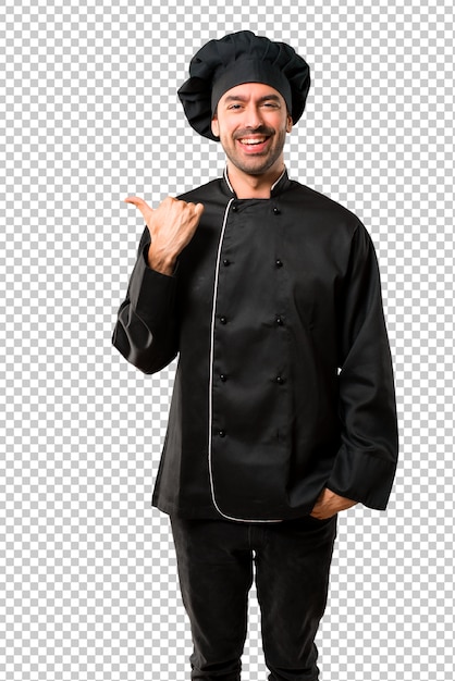 Chef man In black uniform pointing to the side with a finger to present a product