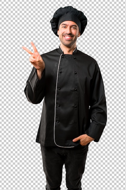 Chef man In black uniform smiling and showing victory sign with a cheerful face