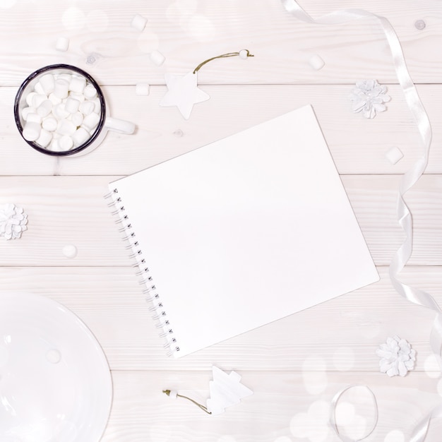 Christmas composition with notepad mockup with white decorations 