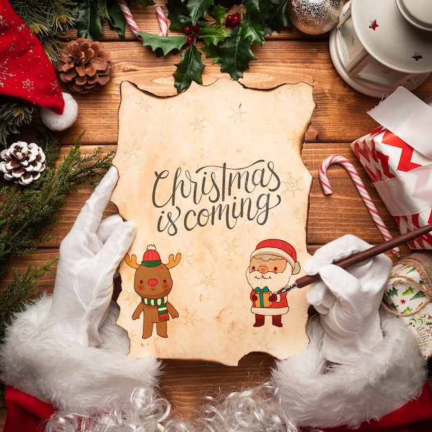 Christmas letter mock-up held by santa