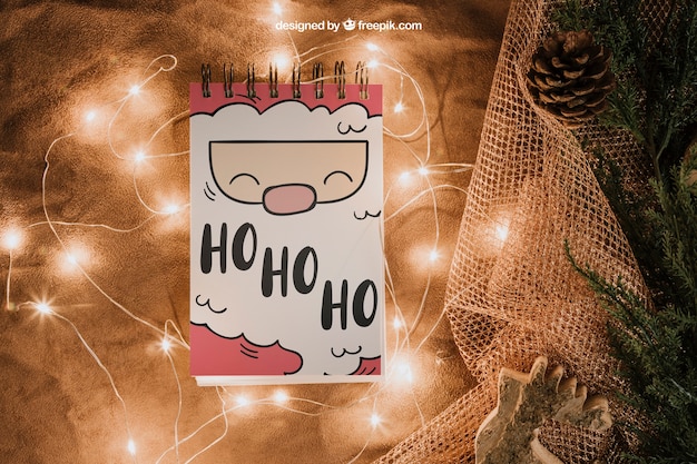 Christmas mockup with notepad and lights