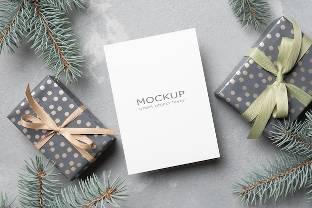 Christmas and New Year greeting card mockup with envelope and gift boxes