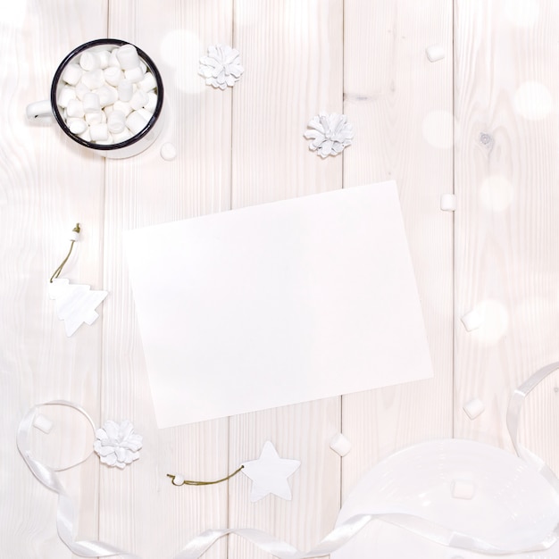 Christmas with card mockup and white decorations on  wood table