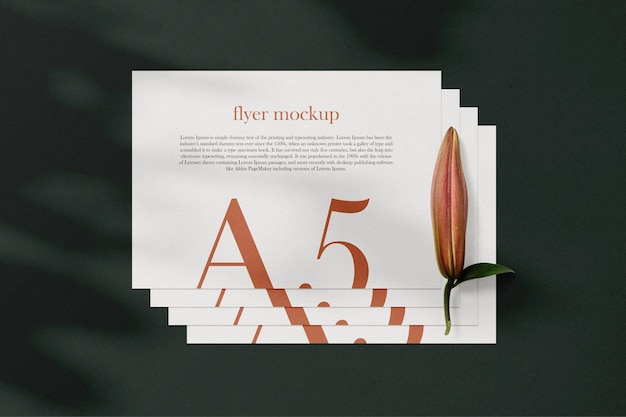 Clean minimal A5 flyer mockup on background with leaves. PSD file.