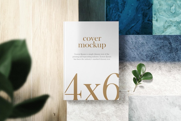 Clean minimal book 4x6 mockup on pool side with leaves background. PSD file.