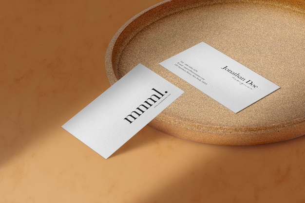 Clean minimal business card mockup on craft plate 