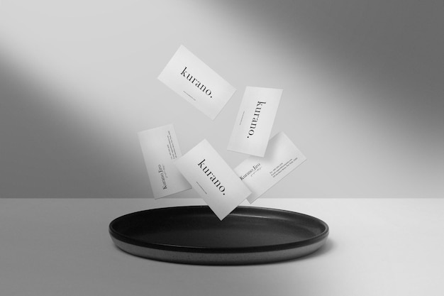 Clean minimal business card mockup float on black plate 