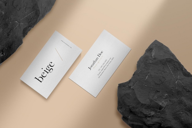 Clean minimal business card mockup on the floor with black stone background.  