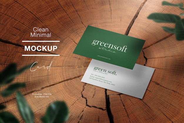 Clean minimal business card mockup on timber and leaves