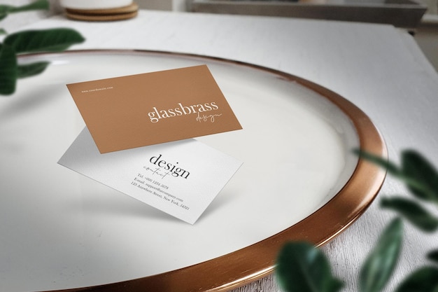 Clean minimal business card mockup on white plate with window shadow