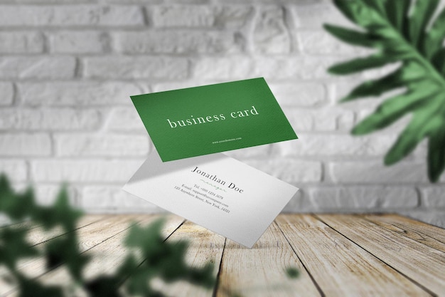 Clean minimal business card mockup on wood background