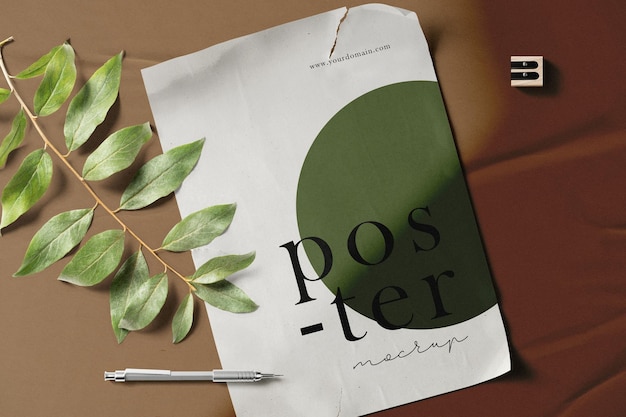 Clean minimal poster mockup on background with leaves and pen. PSD file.