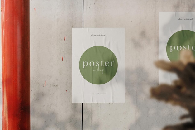 Clean minimal poster mockup on the wall with plant background PSD file