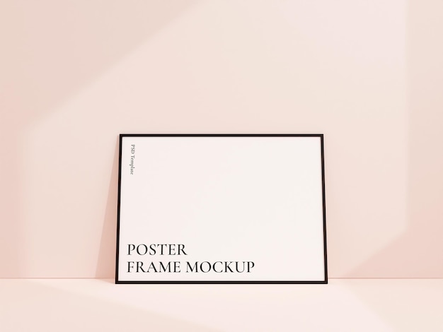 Clean and minimalist front view landscape black photo or poster frame mockup leaning against white wall 3d rendering