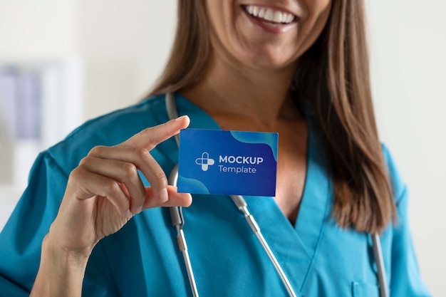 Clinic doctor holding business card mockup