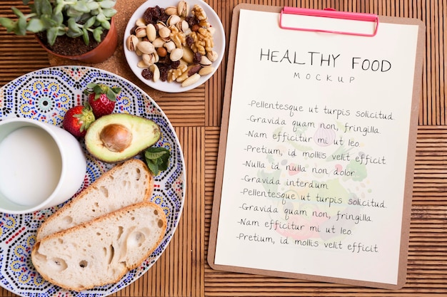 Clipboard beside plate with healthy food