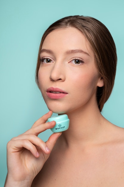 Close up beautiful woman holding container