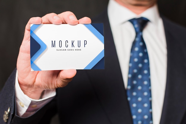 Close-up businessman holding business card