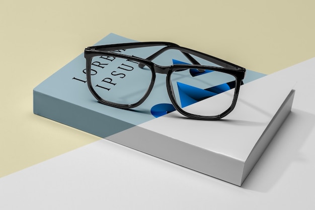 Close-up glasses on book mock-up