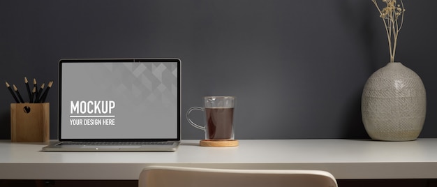 Close up view of worktable with laptop mockup