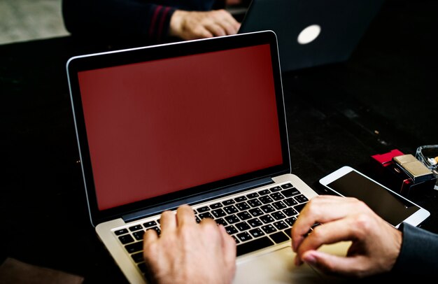 PSD closeup of hand with computer laptop background