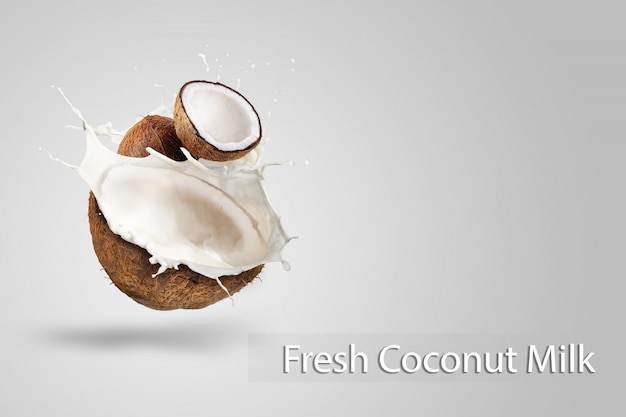 Coconut Milk Splashing isolated on Green background