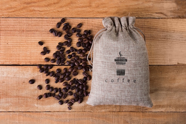 Coffee bag with beans beside