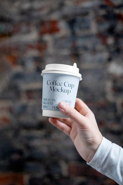 Coffee Cup in Hand Mockup