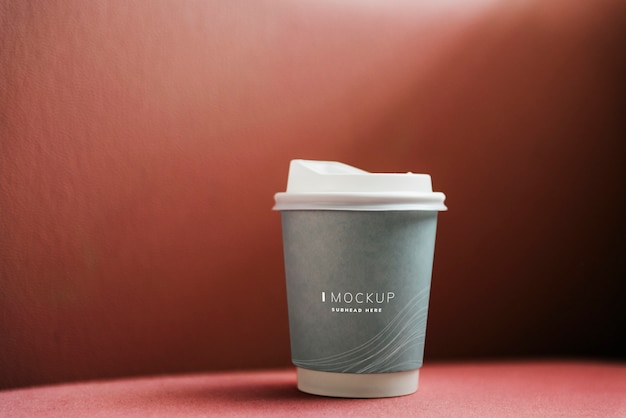 Coffee cup mockup in a red backdrop