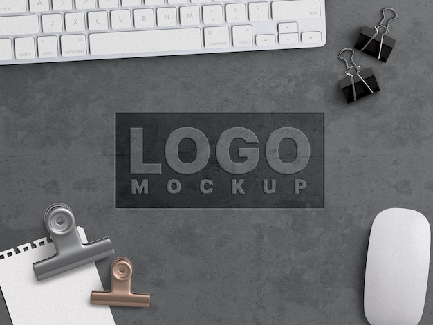 Company business logo mockup work concept carved on grunge concrete surface with office appliances