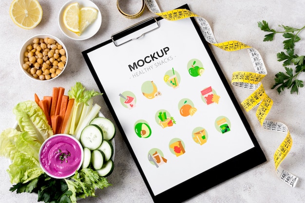 PSD composition of snacks with clipboard mock-up