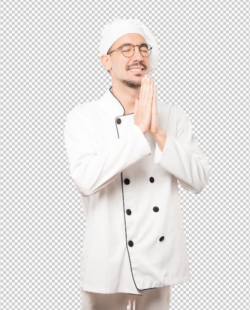 Concerned young chef praying gesture