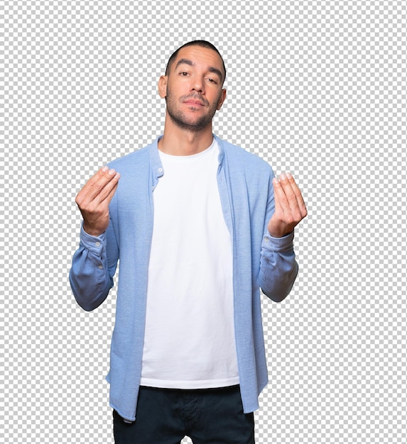 Confused young man making an italian gesture of not understanding