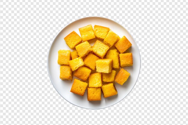 PSD cornbread cubes on a white plate isolated on a transparent background