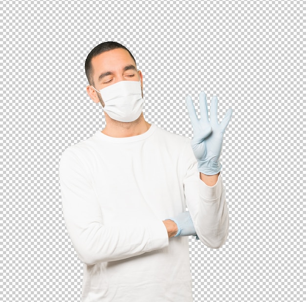 Coronavirus.Young man doing concepts and wearing mask and protective gloves