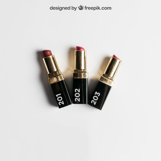 PSD cosmetic mockup with three lipsticks